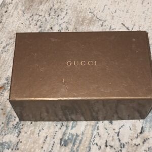 Genuine Gucci sunglass box markings on top small stain on bottom.